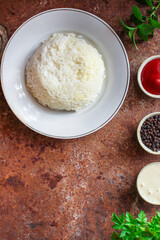 boiled white rice in a plate garnish on the table serving portion size top view place copy space for text keto or paleo diet