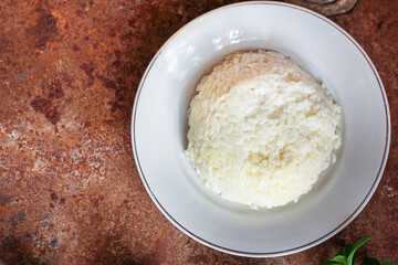 boiled white rice in a plate garnish on the table serving portion size top view place copy space for text keto or paleo diet