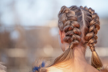 Hairstyle French braid inside out, on the head of a young girl. - obrazy, fototapety, plakaty