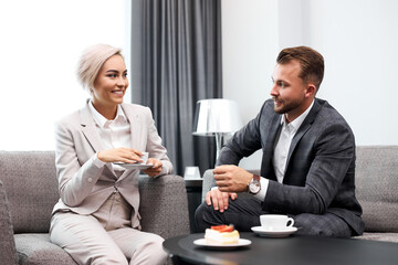 free time of business people, talk and drink tea, elegant lady on meeting with handsome guy, during break