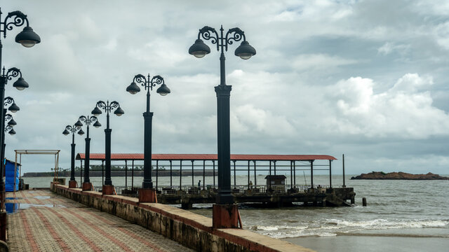 Malvan beach and street lamps on sea
