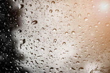 blur backgruond,Rain water on the car glass.