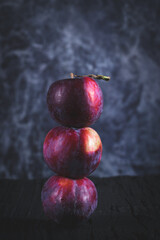 Purple plum on black background