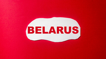 Belarus, word written on a white piece of paper and a red background
