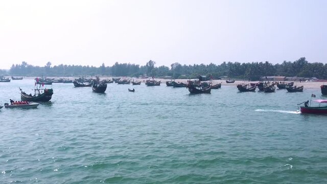Speed boat and heap of fishing boats at Saint Martin zeti ghat . Winter vacation time tourist at sea beach near bay of bangal .
