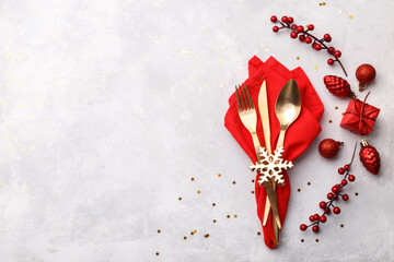 Christmas or new year table setting with golden cutlery