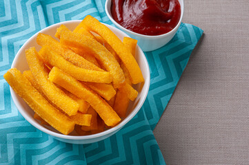 .Fried polenta. Brazilian cuisine appetizer. Copy space. Top view