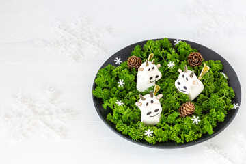 Cow (bull) from marshmallows - symbol of the Chinese New Year. Sweet christmas treat for kids. Copy space