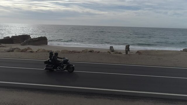aerial image of motorcycle on the beach
