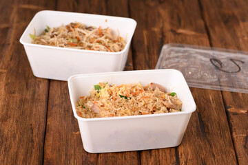 Chinese fast food on the wooden table, rice.