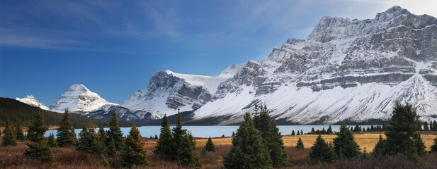 Sunlight on Bow Lake and Peak with Crowfoot mountain and Glacier