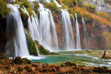 Famous Plitvice lakes with beautiful autumn colors and magnificent views of the waterfalls at  Plitvice national park
