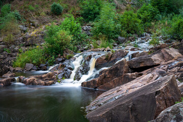 Long exposure waterfall in the forest in Laholm, Sweden.