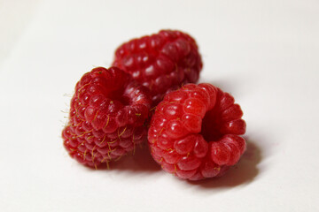 isolated raspberries on white background, healthy food