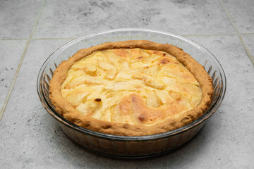 Delicious natural pie with pear and apple cooked at home with warmth, love and care by beloved mother. Shortcrust pastry with toasted crust and a beautiful side. Simple homemade cakes.