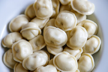 Boiled dumplings on a white plate