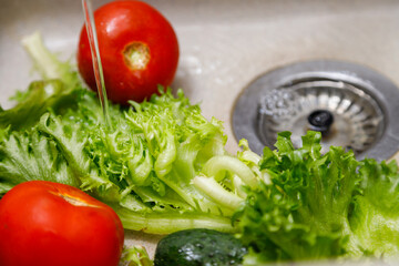 Washing vegetables in the sink