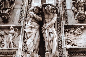 Statues on the facade of the Dome, the famous Cathedral in Milan. Duomo in Italian. The church is a main landmark of the town.