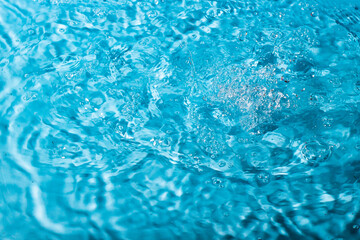 splash of water on a blue background. Abstract wallpaper