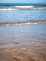 waves on the beach yellow sand blue sea