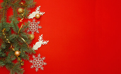 Christmas and New Year composition with golden glitter ball and strip on a red background