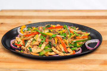 Chicken mushroom and capsicum stir fry recipe served on a sizzling plate. Chicken Fajita Recipe, Asian recipes.