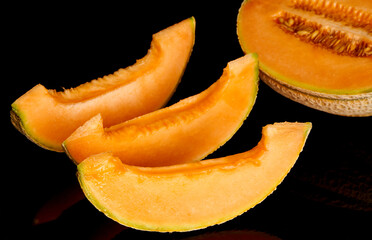 yellow melon on black background