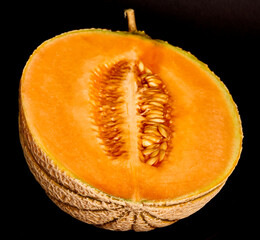 yellow melon on black background
