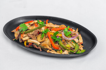 Chicken mushroom and capsicum stir fry recipe served on a sizzling plate. Chicken Fajita Recipe, Asian recipes.