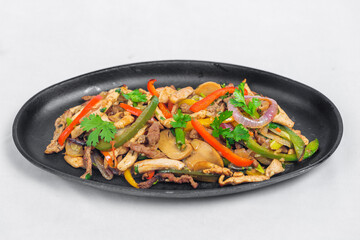 Chicken mushroom and capsicum stir fry recipe served on a sizzling plate. Chicken Fajita Recipe, Asian recipes.