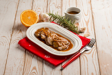 sliced roasted meat witn orange sauce