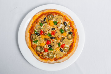 Hot fresh Chicken mushroom jalapeno pizza on white plate isolated white background. Homemade Pizza. Top views.