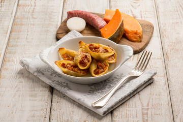 filled pasta with sausage and pumpkin
