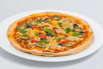 Closeup of Chicken mushroom jalapeno and red pepper pizza on white plate isolated on white background. Homemade Pizza.