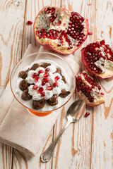 dessert cup with pomegranate chocolate and  chantilly cream