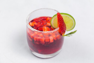Classic frozen strawberry and lime margarita with fresh strawberries. Valentine's dessert recipe. Strawberry juice.