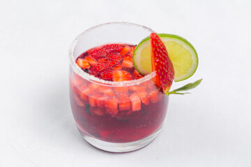 Classic frozen strawberry and lime margarita with fresh strawberries. Valentine's dessert recipe. Strawberry juice.