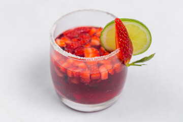 Classic frozen strawberry and lime margarita with fresh strawberries. Valentine's dessert recipe. Strawberry juice.