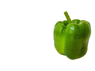 Green bell pepper on a white background. The concept of a healthy diet.
