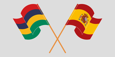 Crossed and waving flags of Mauritius and Spain