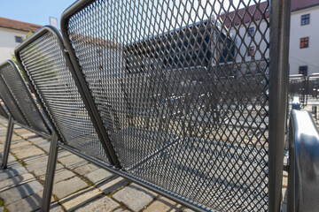 Wire chairs to sit in the courtyard in front of the stage.