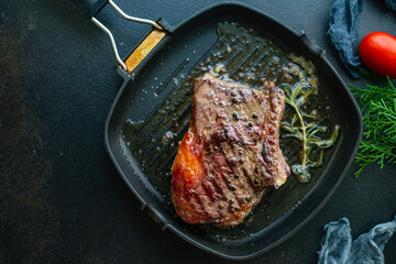 beef steak ribeye grilled veal meat juicy and fried rare or medium on the table tasty serving size portion top view place copy space for text