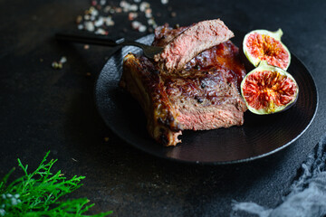 beef steak ribeye grilled veal meat juicy and fried rare or medium on the table tasty serving size portion top view place copy space for text