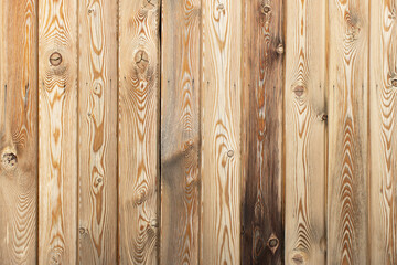 Wooden decorative background with place for text. Light brown larch boards with knots and holes, abstract texture. Empty template. Concept of natural materials for home decoration. Horizontal