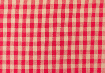 Close up of a red and white checkered tablecloth
