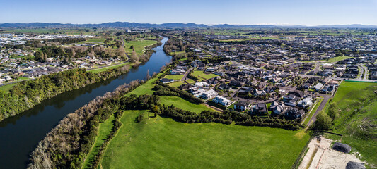 Fototapeta na wymiar Aerial view of the Waikato River looking North towards Ngaruawahia in Hamilton, New Zealand