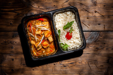 Ready-made dietary takeaway food on old wooden background