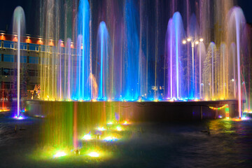 Fragment of a beautiful multi-colored fountain installed near the administration building of the...