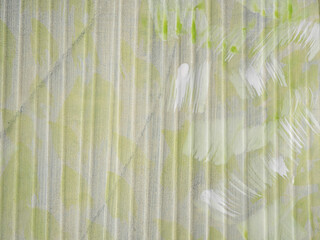 Textured wall embossed and painted in yellows and grey for graphic resource.