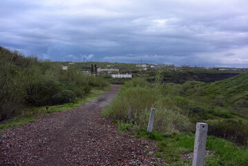 evening sun sets summer of Russia green path